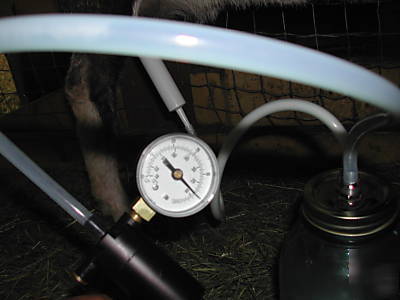 Goat milking machine (hand operated vacuum milker)