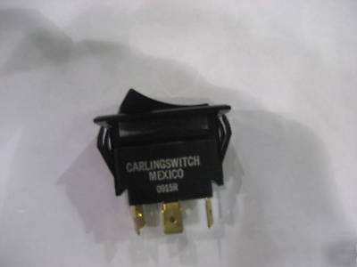 Lighted rocker carling switch