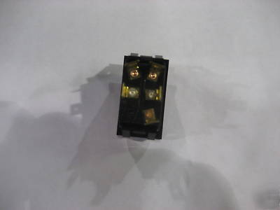 Lighted rocker carling switch