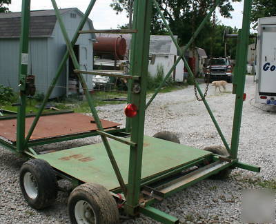 Custom trailer for outdoor boiler furnaces with hoist