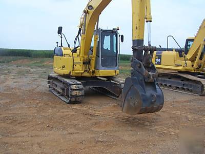 Komatsu PC128US-2 excavator construction equipment..