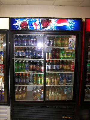 3 true two door coolers with logo pepsi, coke, and 7-up