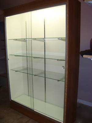 Display case-four glass shelves-sliding glass doors