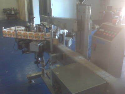 Labeler - front & back labeler with top hold down belt