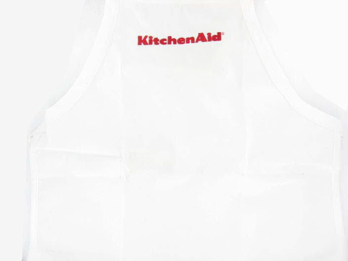 White kitchenaid apron with embossed red logo