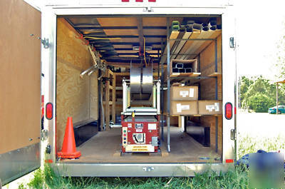 Seamless gutter machine with enclosed trailer