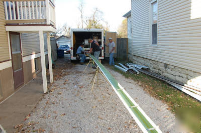 Seamless gutter machine with enclosed trailer