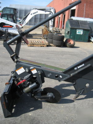 Bobcat silt fence installer attachment for skid steer