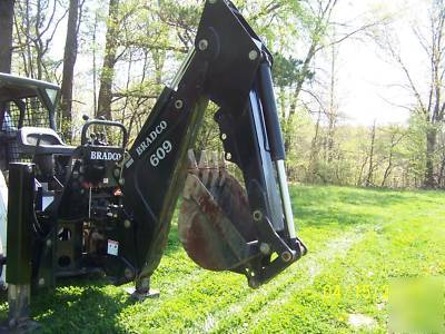 New next to bradco 609 skidloader backhoe attachment