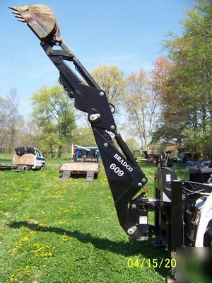 New next to bradco 609 skidloader backhoe attachment