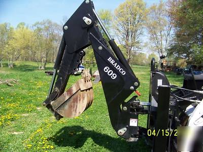 New next to bradco 609 skidloader backhoe attachment