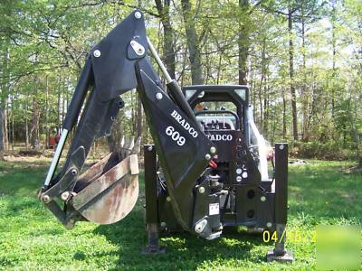 New next to bradco 609 skidloader backhoe attachment