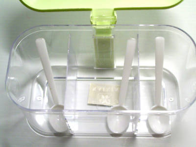 Plastic condiment container storage with 3 spoons