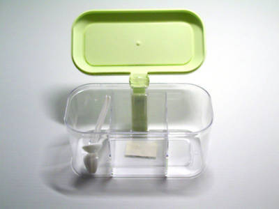 Plastic condiment container storage with 3 spoons
