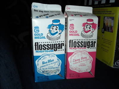 Cotton candy machine with two containers of floss