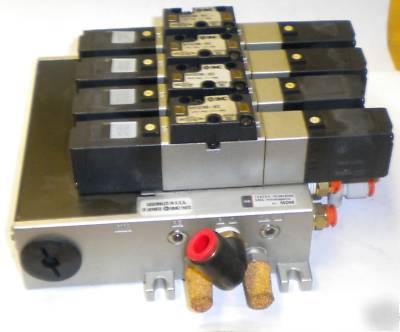 4 smc NVFS2300-5FZ series solenoids on manifold