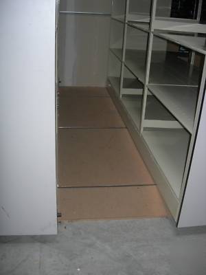 Spacesaver corporation library shelving system on rails
