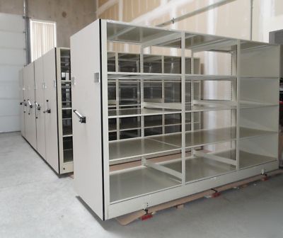 Spacesaver corporation library shelving system on rails